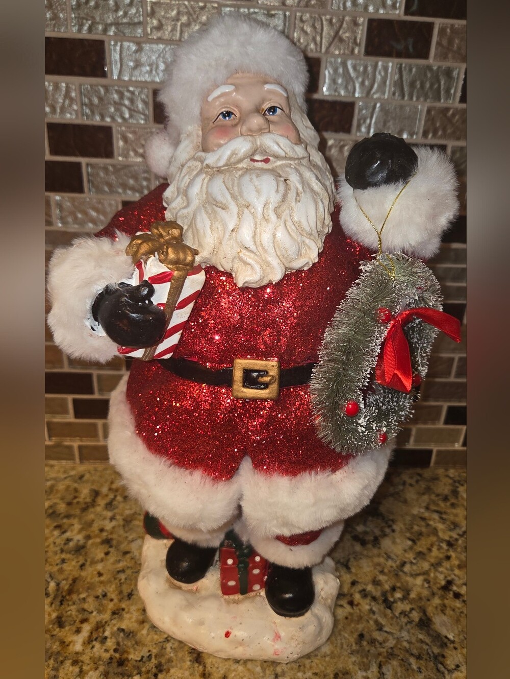 Retro Glittered Jacket Santa Claus With Bristle Wreath And Holding Gift 15.25"